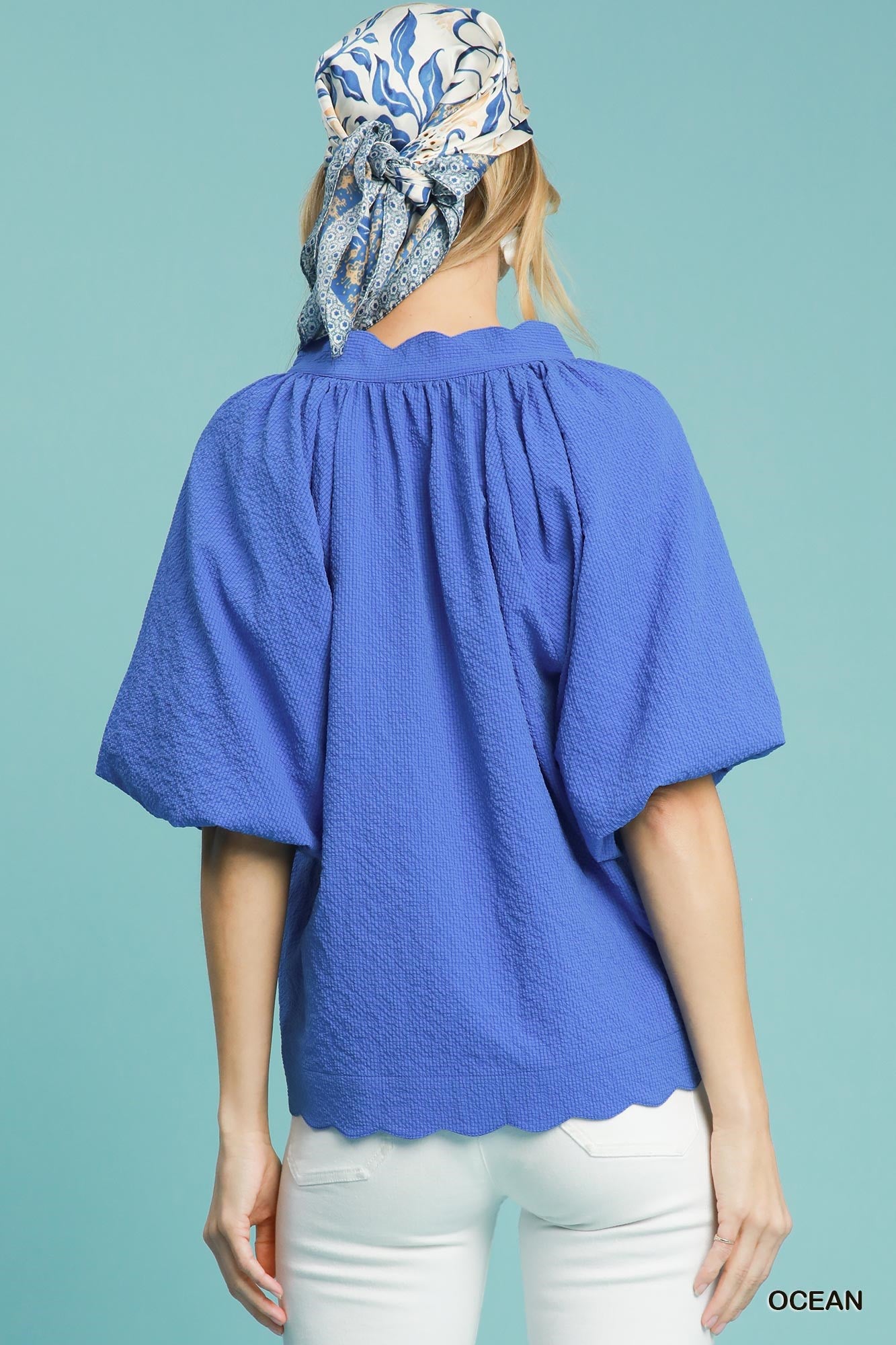 Scalloped hemline blue top