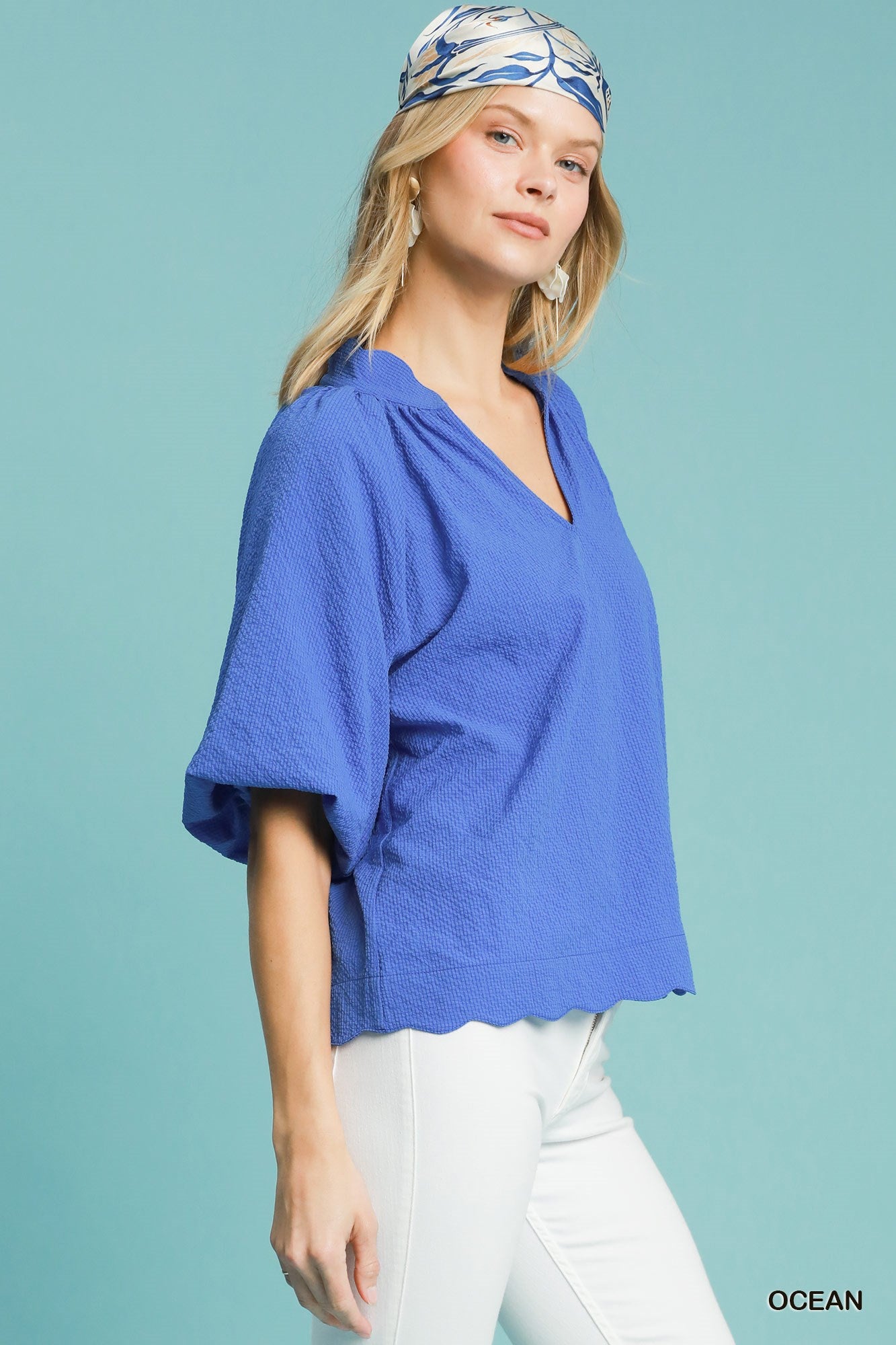 Scalloped hemline blue top