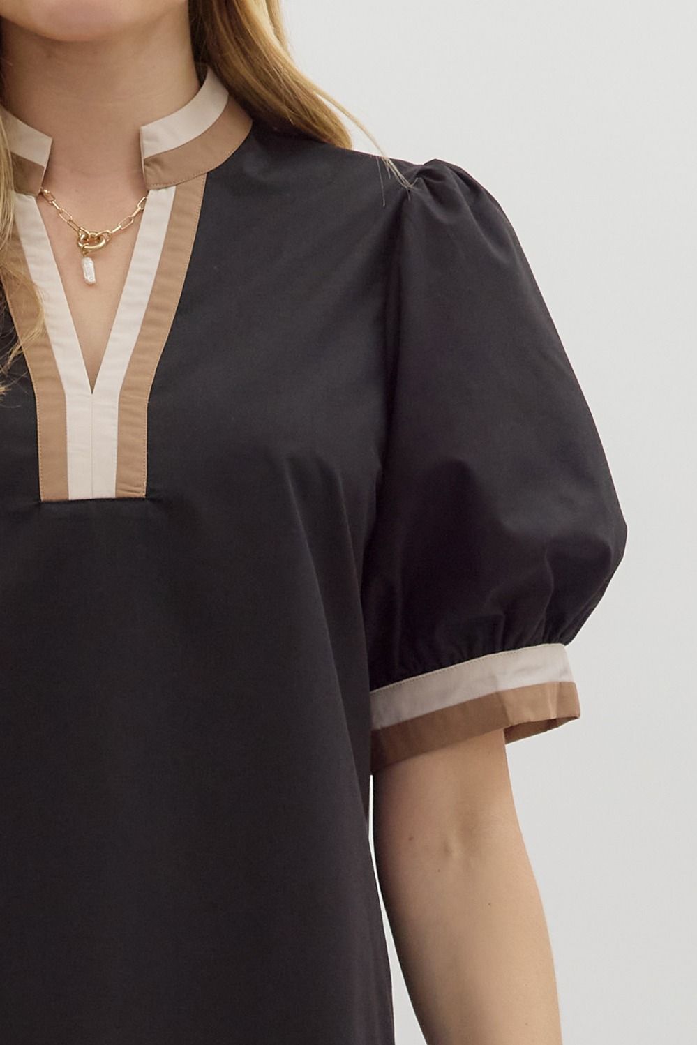 Black top with neutral trim