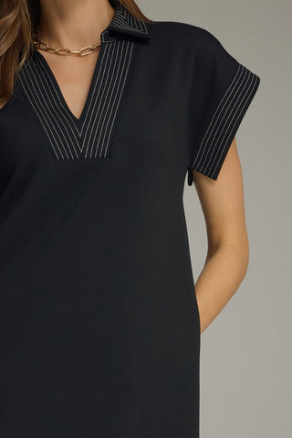 Black knit dress with white topstitching by Entro