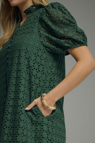 Green eyelet lace midi dress with puff sleeves and side pockets from Entro. 