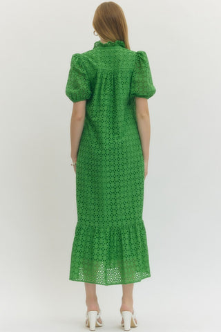 Green dress with puff sleeves worn by a person rear view