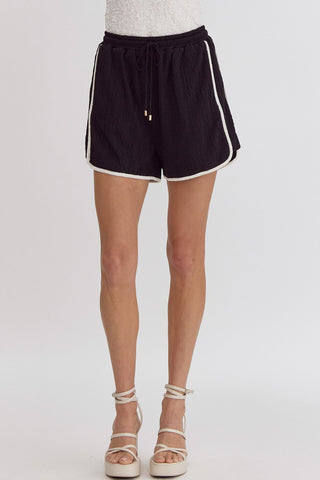 Black shorts with white stripes by Entro