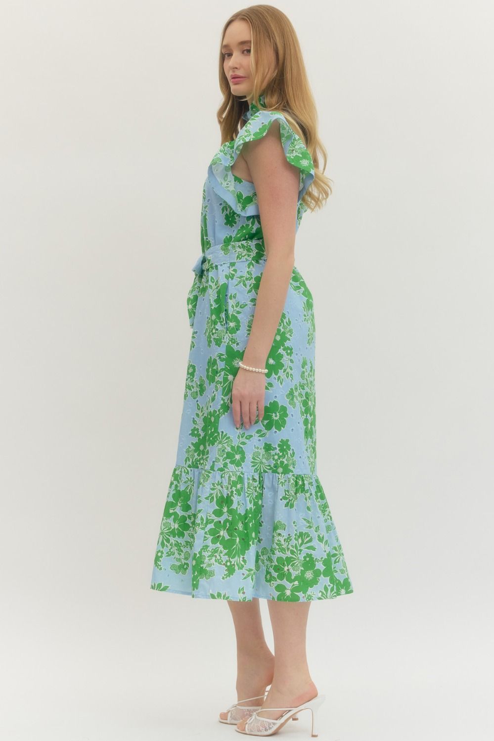 Woman wearing a floral dress on a white background