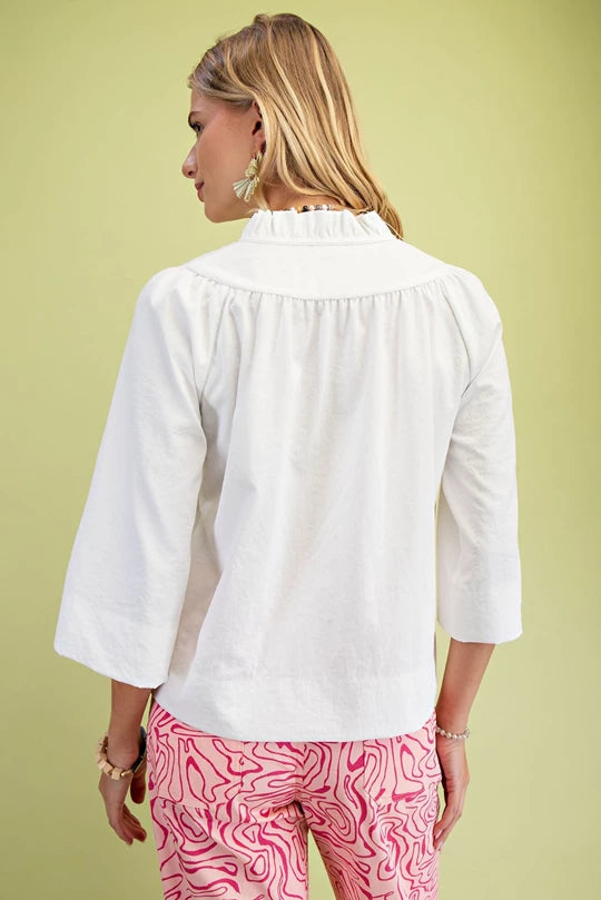 White ruffled collar blouse