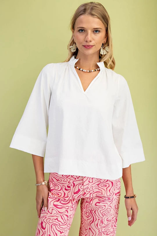 White ruffled collar blouse