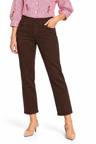 A model wearing Tru Luxe Jeans dark brown cropped ankle-length denim, styled with a red and white striped embroidered blouse and beige heels, against a plain white background.