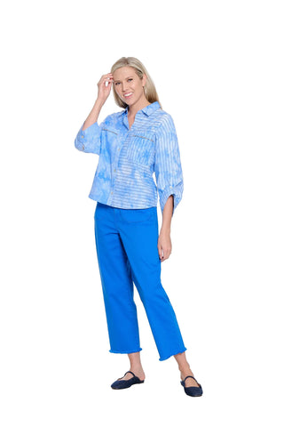Woman wearing a blue and white striped shirt and blue pants on a white background