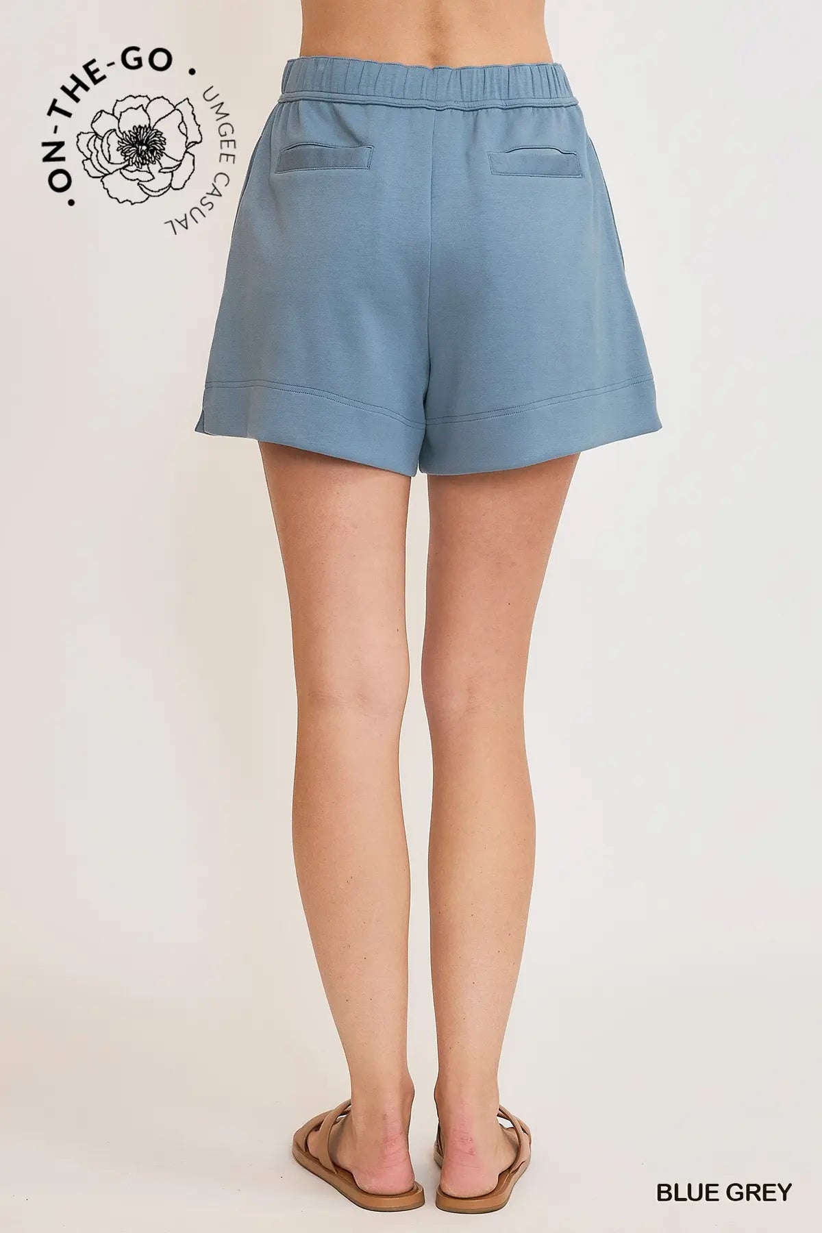 Blue gray shorts worn by a person on a white background with 'On-The-Go' branding.
