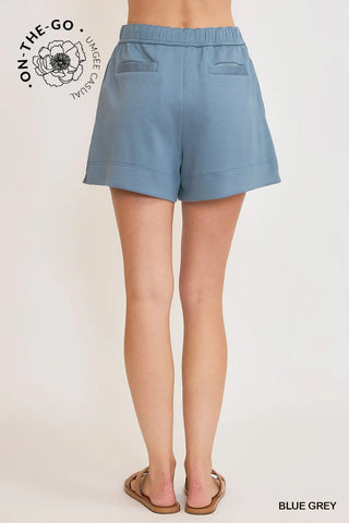 Blue gray shorts worn by a person on a white background with 'On-The-Go' branding.