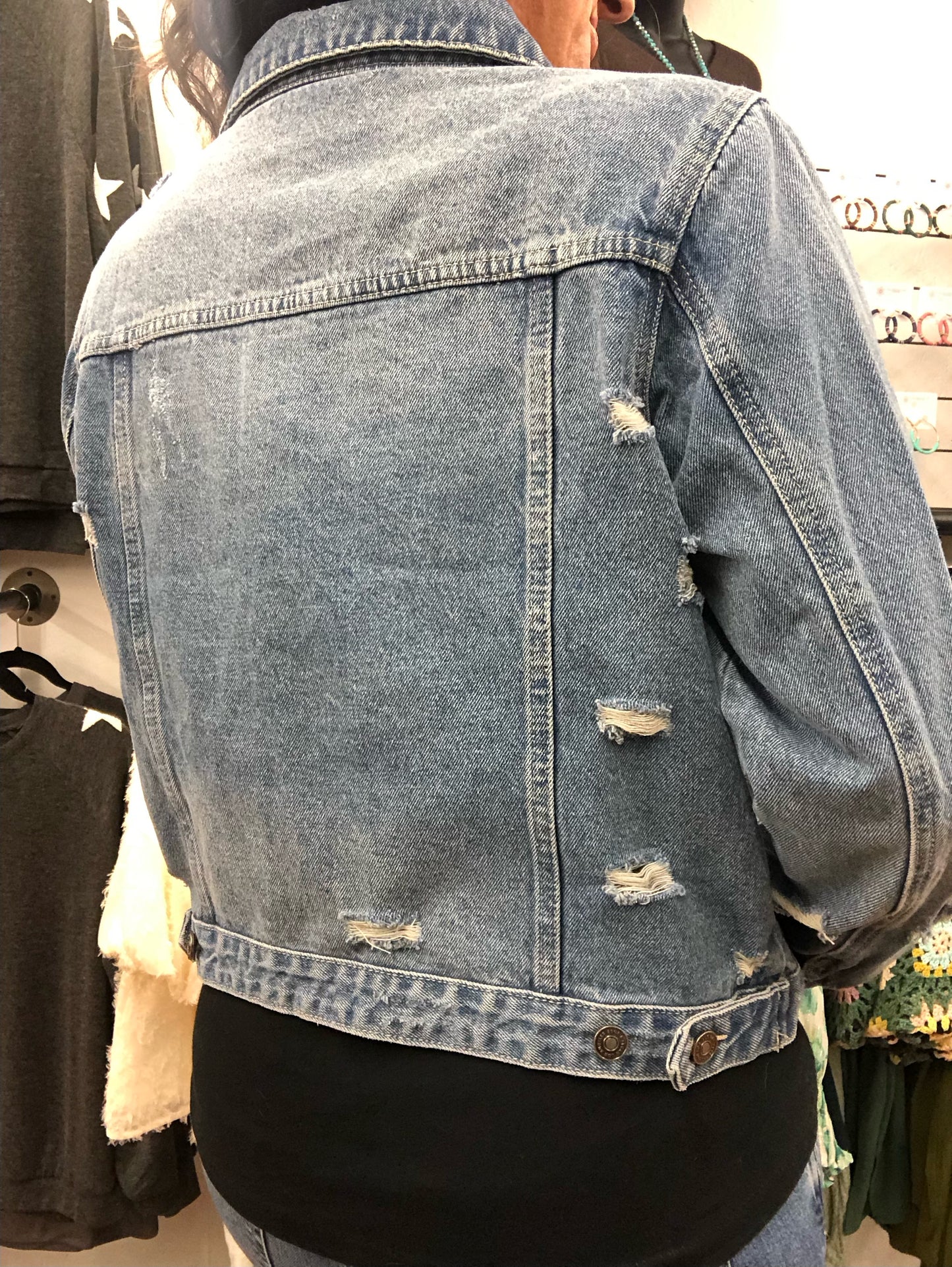 Distressed denim jacket